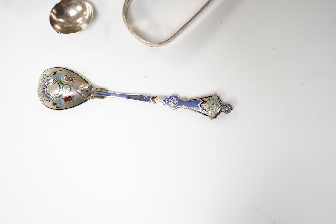 A George III silver pedestal salt, London, 1805, diameter 84mm, together with a pair of Georgian silver sugar tongs, two silver condiment spoons and a Russian 84 zolotnik and polychrome cloisonne enamel spoon, 11.1cm.